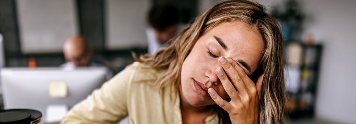 Chiropractic Georgetown ON Head Pain Women At Table